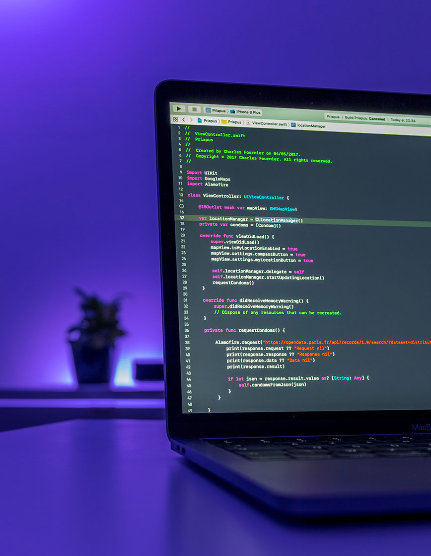 Laptop with Coding on Screen Laptop with Coding on Screen